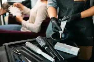 Woman recieving a semi-permanent hair colouring treatment in London